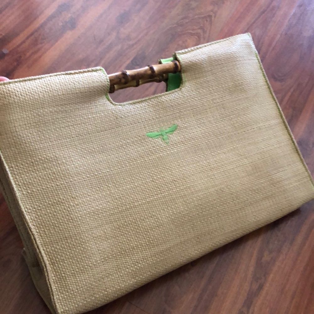 BUZZ by Jane Fox Bamboo handle woven rattan bag.